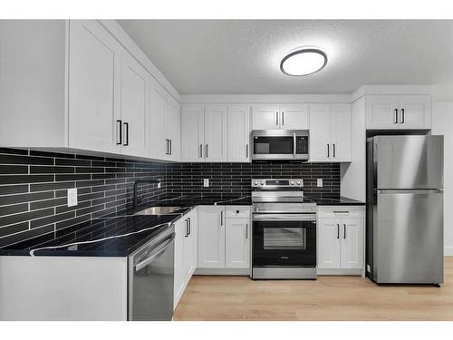 3535 40 Street Sw, Calgary, AB - Indoor Photo Showing Kitchen With Stainless Steel Kitchen