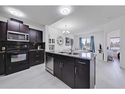 4306-5605 Henwood Street Sw, Calgary, AB - Indoor Photo Showing Kitchen With Double Sink