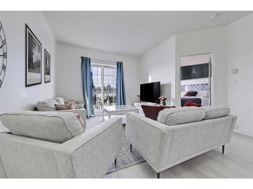 4306-5605 Henwood Street Sw, Calgary, AB - Indoor Photo Showing Living Room With Fireplace