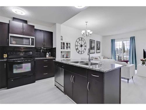 4306-5605 Henwood Street Sw, Calgary, AB - Indoor Photo Showing Kitchen With Double Sink