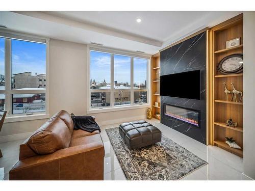 201,203,205-65 Edmonton Trail Ne, Calgary, AB - Indoor Photo Showing Living Room With Fireplace