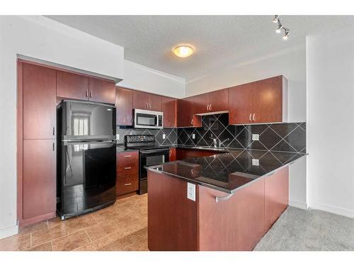 1701-8880 Horton Road Sw, Calgary, AB - Indoor Photo Showing Kitchen