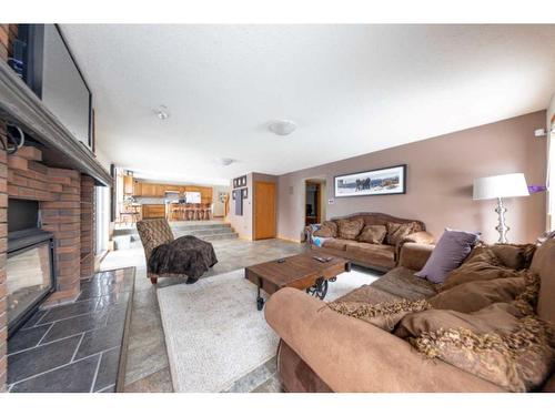 3801 57A Avenue, Lloydminster, AB - Indoor Photo Showing Living Room With Fireplace