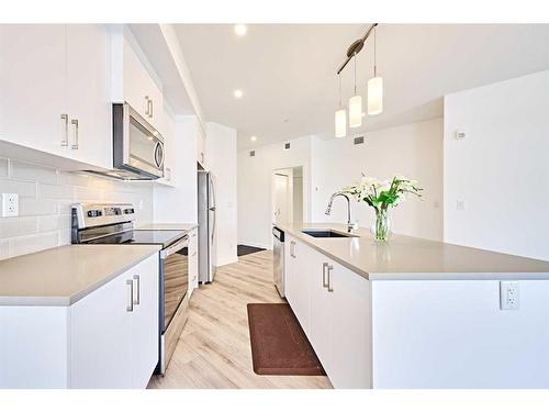 307-205 Spring Creek Common Sw, Calgary, AB - Indoor Photo Showing Kitchen With Upgraded Kitchen