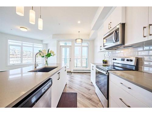 307-205 Spring Creek Common Sw, Calgary, AB - Indoor Photo Showing Kitchen With Upgraded Kitchen