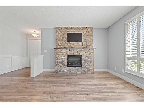 315 Woodridge Place Sw, Calgary, AB - Indoor Photo Showing Living Room With Fireplace