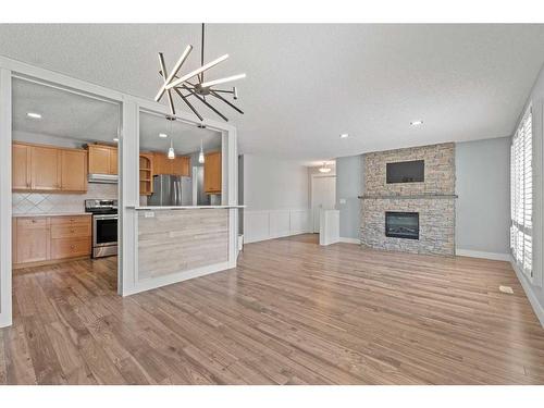 315 Woodridge Place Sw, Calgary, AB - Indoor With Fireplace