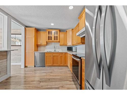 315 Woodridge Place Sw, Calgary, AB - Indoor Photo Showing Kitchen With Stainless Steel Kitchen