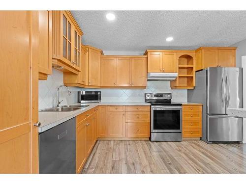 315 Woodridge Place Sw, Calgary, AB - Indoor Photo Showing Kitchen With Stainless Steel Kitchen With Double Sink