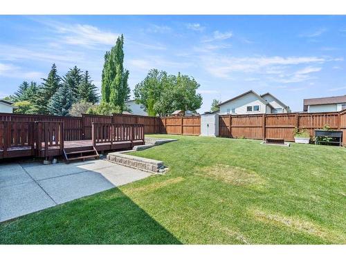 315 Woodridge Place Sw, Calgary, AB - Outdoor With Backyard