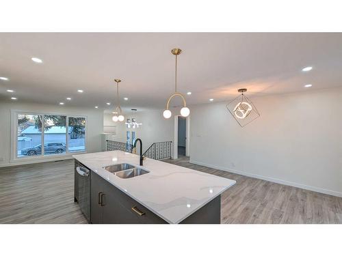 219 Midlawn Close Se, Calgary, AB - Indoor Photo Showing Kitchen With Double Sink