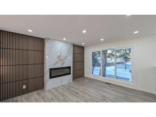 219 Midlawn Close Se, Calgary, AB - Indoor With Fireplace