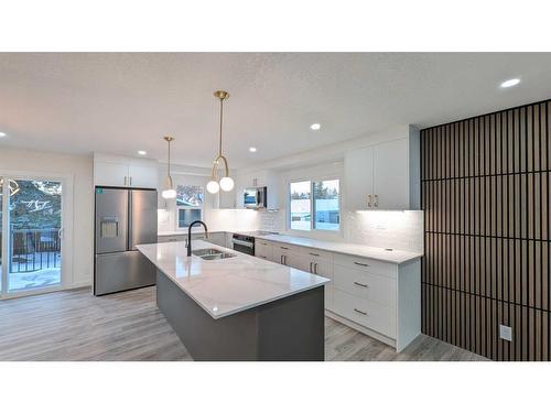 219 Midlawn Close Se, Calgary, AB - Indoor Photo Showing Kitchen With Double Sink With Upgraded Kitchen