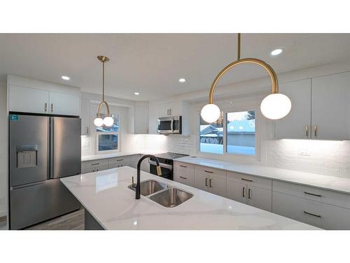 219 Midlawn Close Se, Calgary, AB - Indoor Photo Showing Kitchen With Stainless Steel Kitchen With Double Sink With Upgraded Kitchen