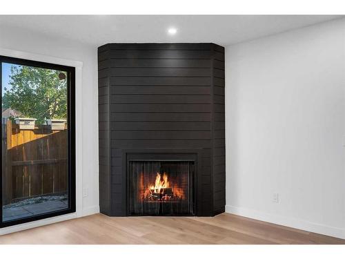 87-2511 38 Street Ne, Calgary, AB - Indoor Photo Showing Living Room With Fireplace