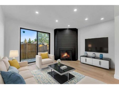 87-2511 38 Street Ne, Calgary, AB - Indoor Photo Showing Living Room With Fireplace