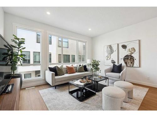 309-265 Sage Hill Rise Nw, Calgary, AB - Indoor Photo Showing Living Room