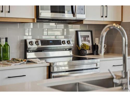 309-265 Sage Hill Rise Nw, Calgary, AB - Indoor Photo Showing Kitchen With Double Sink