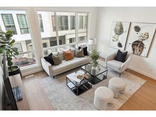 309-265 Sage Hill Rise Nw, Calgary, AB - Indoor Photo Showing Living Room