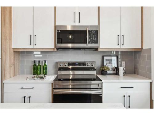 309-265 Sage Hill Rise Nw, Calgary, AB - Indoor Photo Showing Kitchen With Upgraded Kitchen