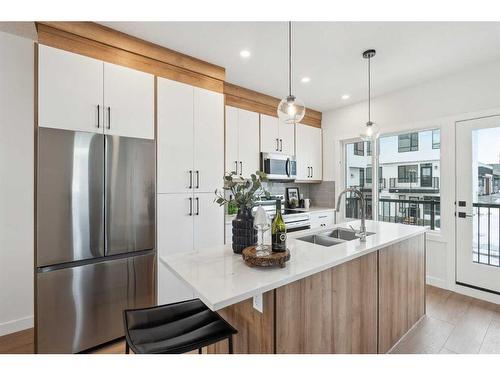 309-265 Sage Hill Rise Nw, Calgary, AB - Indoor Photo Showing Kitchen With Double Sink With Upgraded Kitchen