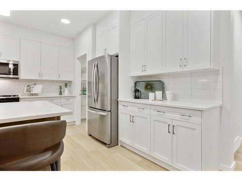 907 Langholm Drive Se, Airdrie, AB - Indoor Photo Showing Kitchen