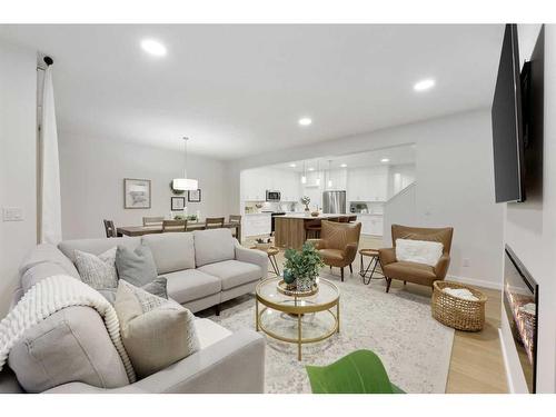 907 Langholm Drive Se, Airdrie, AB - Indoor Photo Showing Living Room