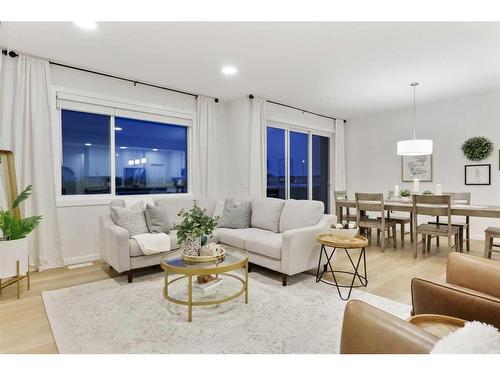 907 Langholm Drive Se, Airdrie, AB - Indoor Photo Showing Living Room