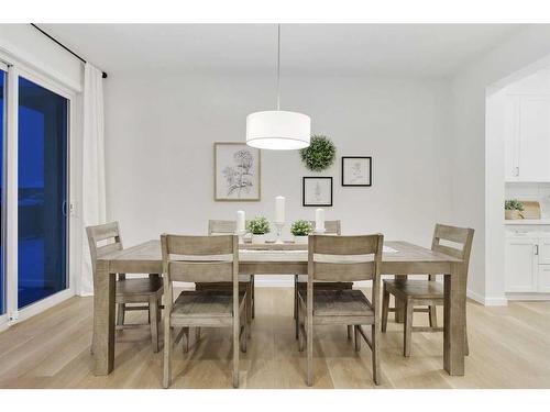 907 Langholm Drive Se, Airdrie, AB - Indoor Photo Showing Dining Room