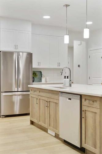 907 Langholm Drive Se, Airdrie, AB - Indoor Photo Showing Kitchen