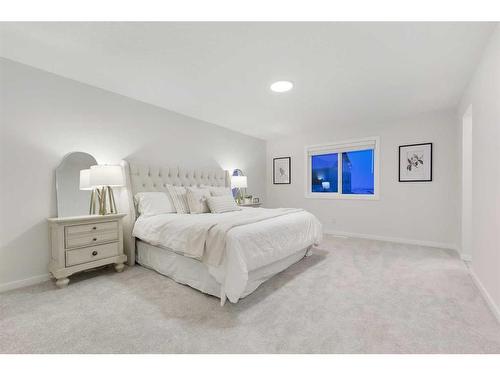 907 Langholm Drive Se, Airdrie, AB - Indoor Photo Showing Bedroom