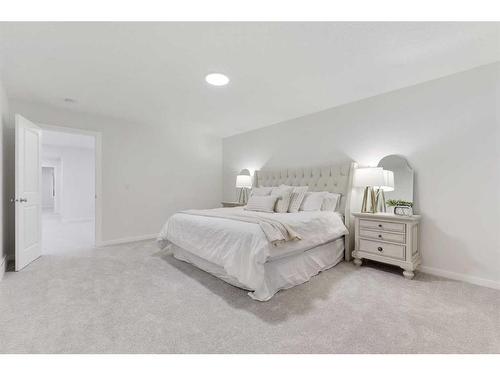 907 Langholm Drive Se, Airdrie, AB - Indoor Photo Showing Bedroom