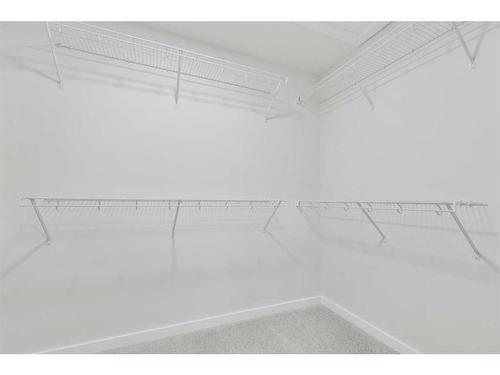 907 Langholm Drive Se, Airdrie, AB - Indoor With Storage