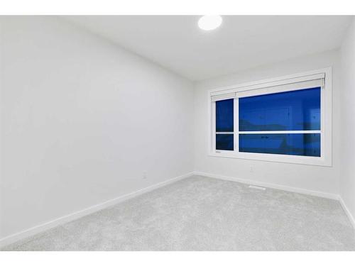 907 Langholm Drive Se, Airdrie, AB - Indoor Photo Showing Other Room