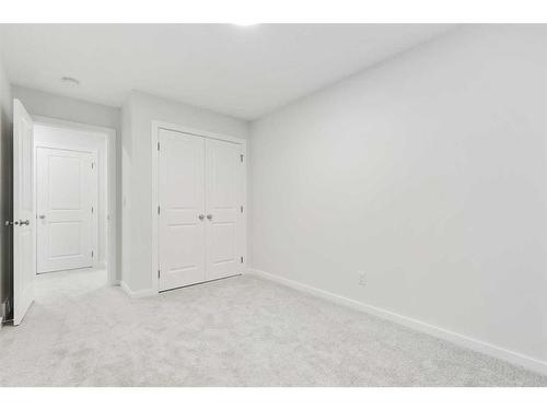 907 Langholm Drive Se, Airdrie, AB - Indoor Photo Showing Other Room