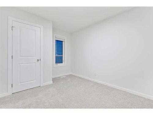 907 Langholm Drive Se, Airdrie, AB - Indoor Photo Showing Other Room