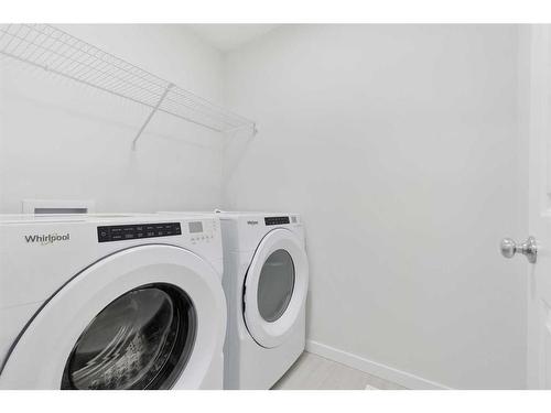 907 Langholm Drive Se, Airdrie, AB - Indoor Photo Showing Laundry Room