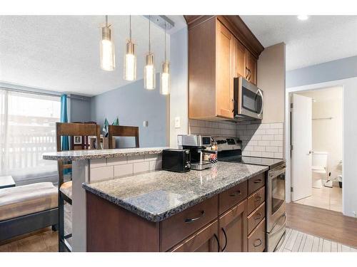 205-507 57 Avenue Sw, Calgary, AB - Indoor Photo Showing Kitchen With Upgraded Kitchen