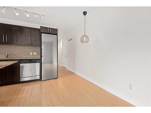 305-824 4 Avenue Nw, Calgary, AB - Indoor Photo Showing Kitchen With Stainless Steel Kitchen