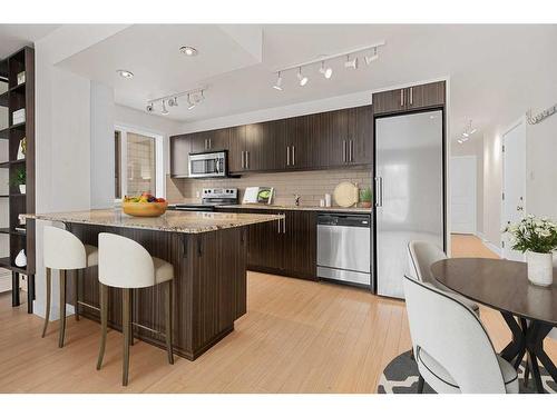 305-824 4 Avenue Nw, Calgary, AB - Indoor Photo Showing Kitchen With Stainless Steel Kitchen With Upgraded Kitchen