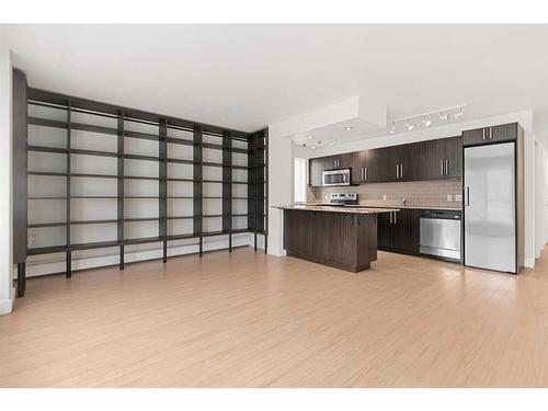 305-824 4 Avenue Nw, Calgary, AB - Indoor Photo Showing Kitchen With Stainless Steel Kitchen