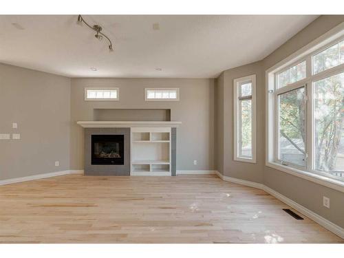 2-1617 27 Avenue Sw, Calgary, AB - Indoor Photo Showing Living Room With Fireplace