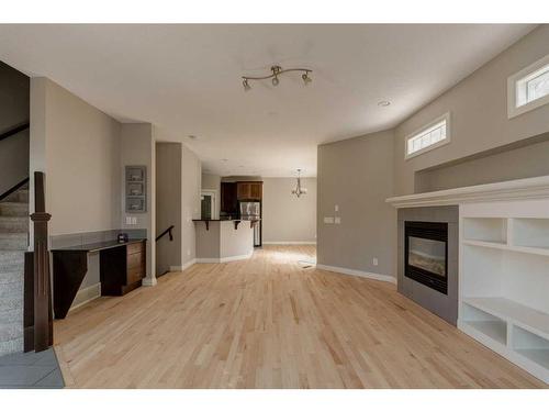 2-1617 27 Avenue Sw, Calgary, AB - Indoor Photo Showing Living Room With Fireplace