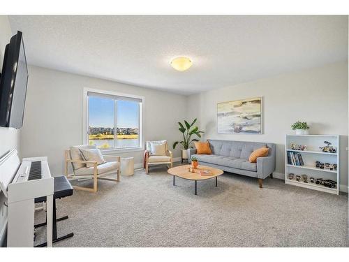 144 Marquis View Se, Calgary, AB - Indoor Photo Showing Living Room