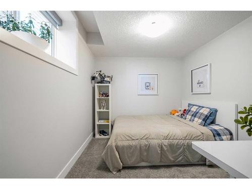 144 Marquis View Se, Calgary, AB - Indoor Photo Showing Bedroom