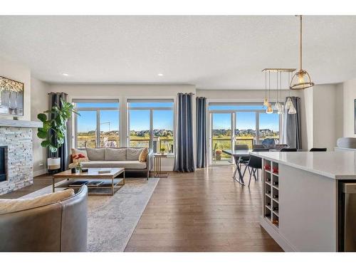 144 Marquis View Se, Calgary, AB - Indoor Photo Showing Living Room With Fireplace