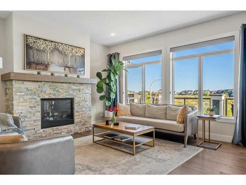 144 Marquis View Se, Calgary, AB - Indoor Photo Showing Living Room With Fireplace