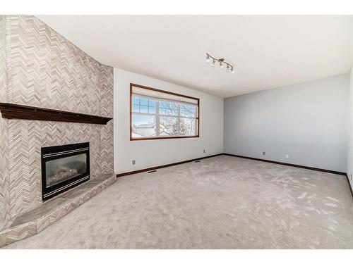 114 Bow Ridge Crescent, Cochrane, AB - Indoor With Fireplace