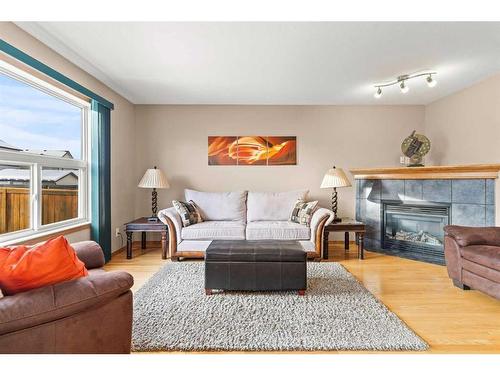 210 Saddlemont Boulevard Ne, Calgary, AB - Indoor Photo Showing Living Room With Fireplace