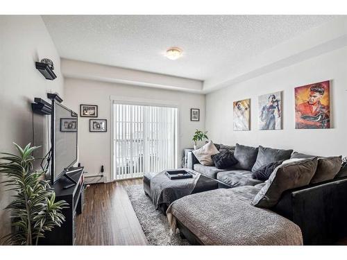 1402-99 Copperstone Park Se, Calgary, AB - Indoor Photo Showing Living Room